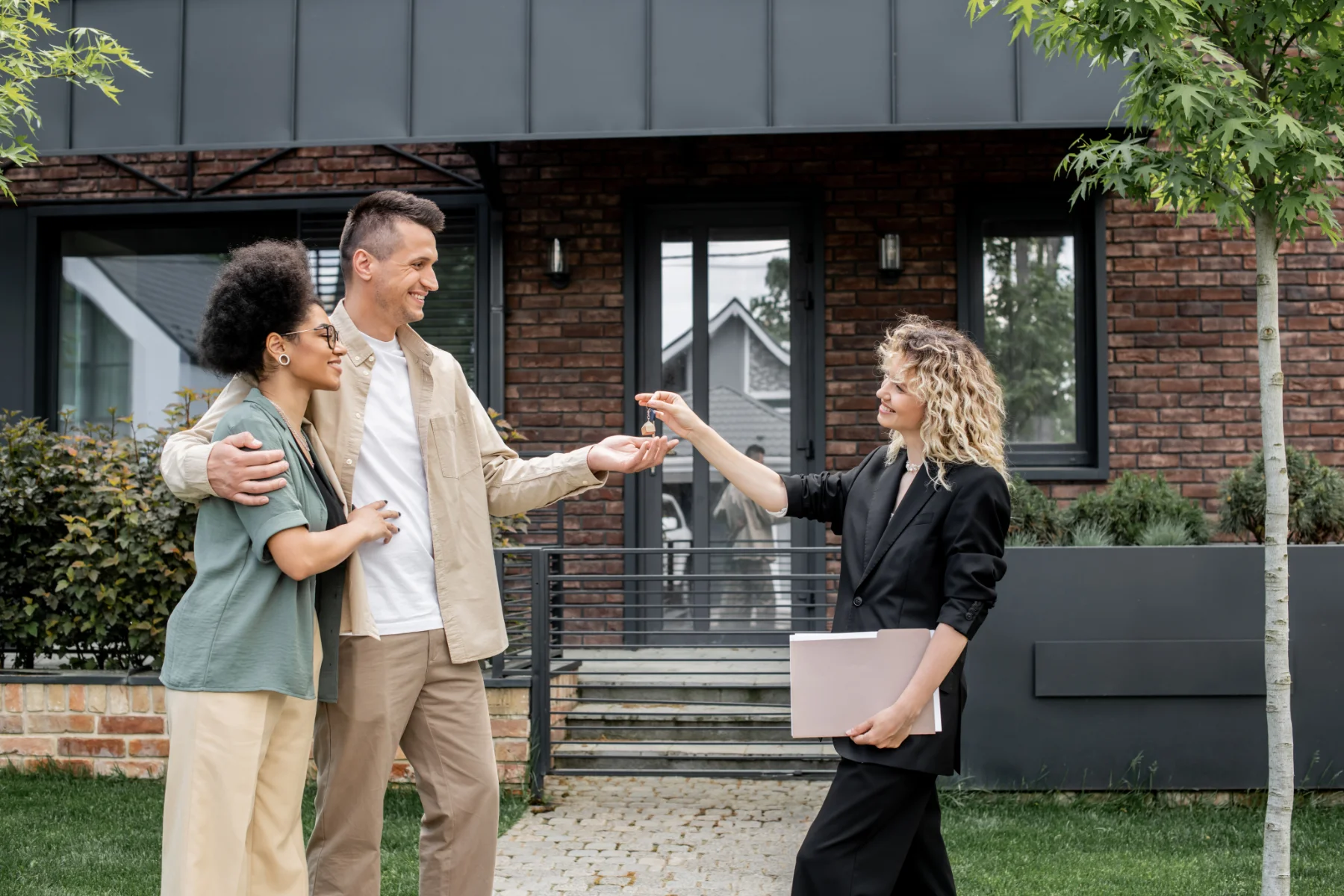 real-estate-broker-with-folder-giving-key-to-overj-2026-03-11-04-18-21-utc